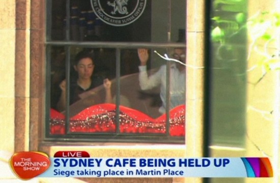 Developing story: At least 10 hostages held inside Sydney cafe